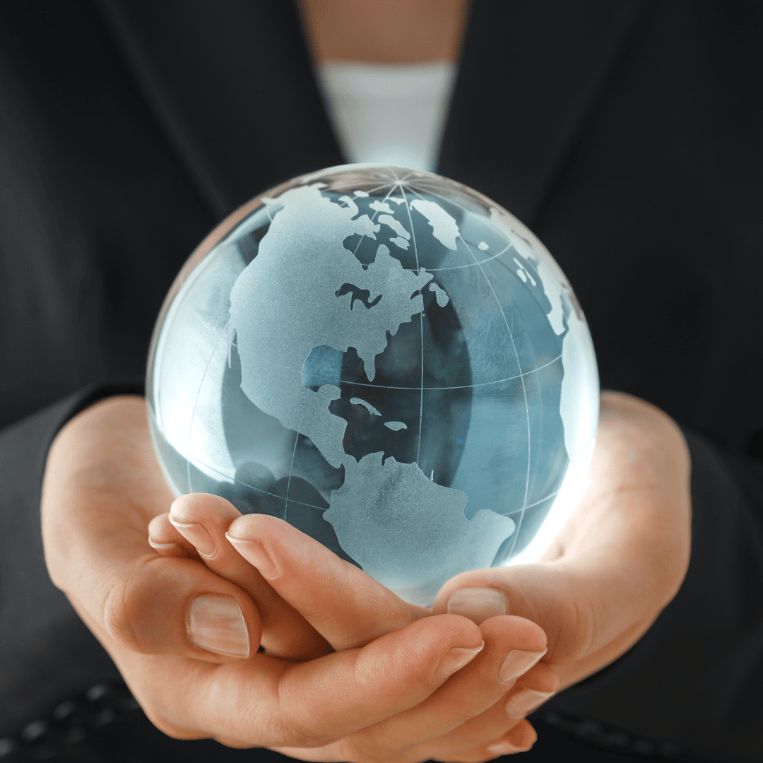 Business person holding globe in their hands